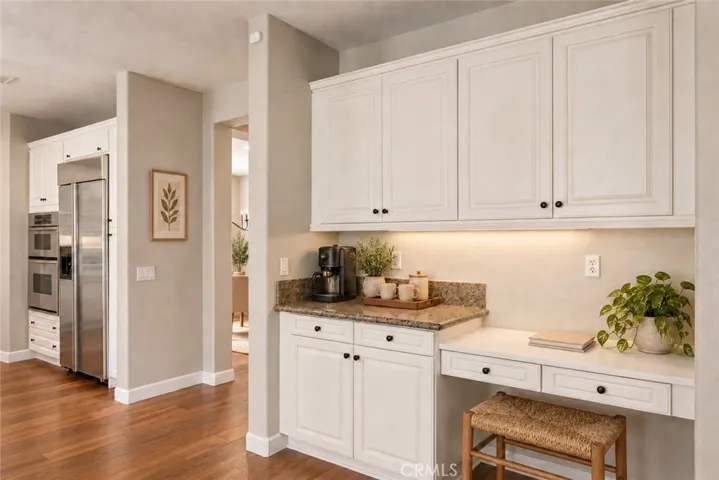 Virtual stage. Accessory desk and cabinet space in kitchen.