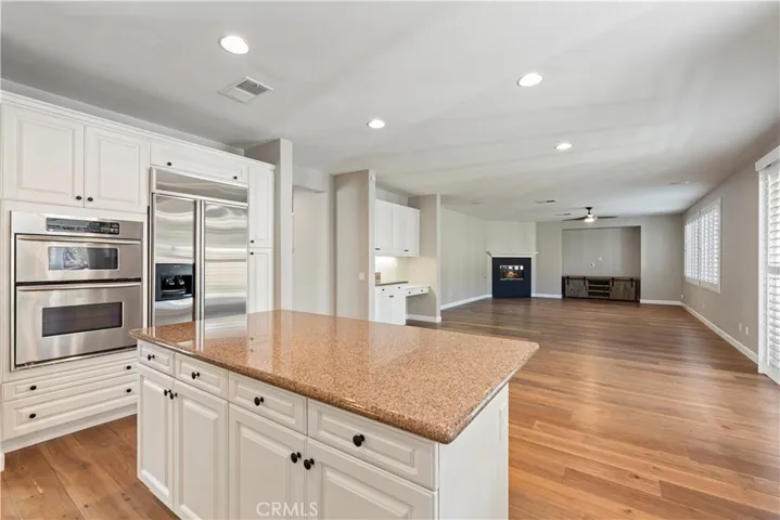 Large open-concept family room connects with kitchen.