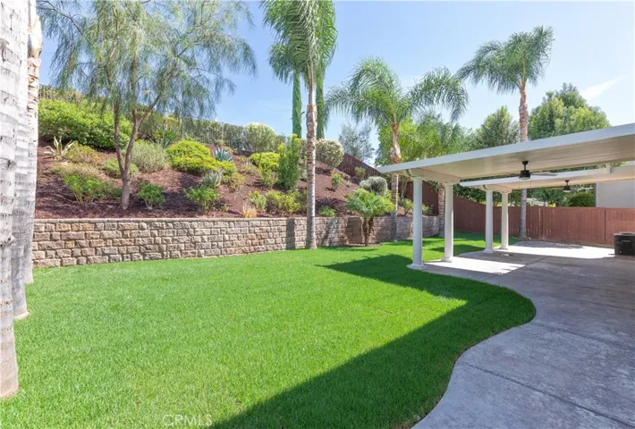 Large rear yard. New grass. Nice retaining wall with manicured slope. Peaceful and private.