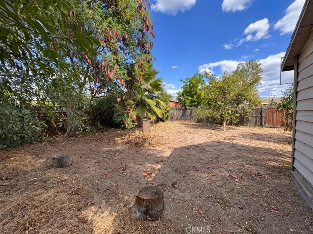 Backyard sideview- AI enhanced to remove personal items