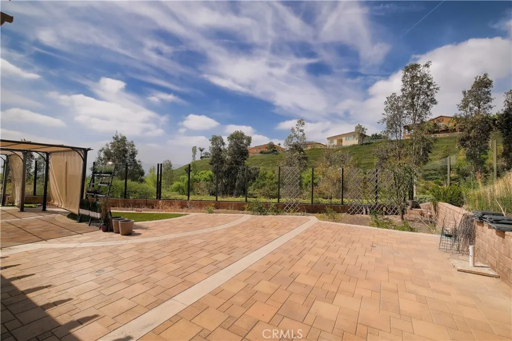Generous paved patio offers flexible space for outdoor dining, seating, and entertaining. Generous paved patio offers flexible space for outdoor dining, seating, and entertaining.