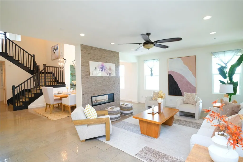 Open family room with comfortable gathering space and views toward the staircase. Open family room with comfortable gathering space and views toward the staircase.