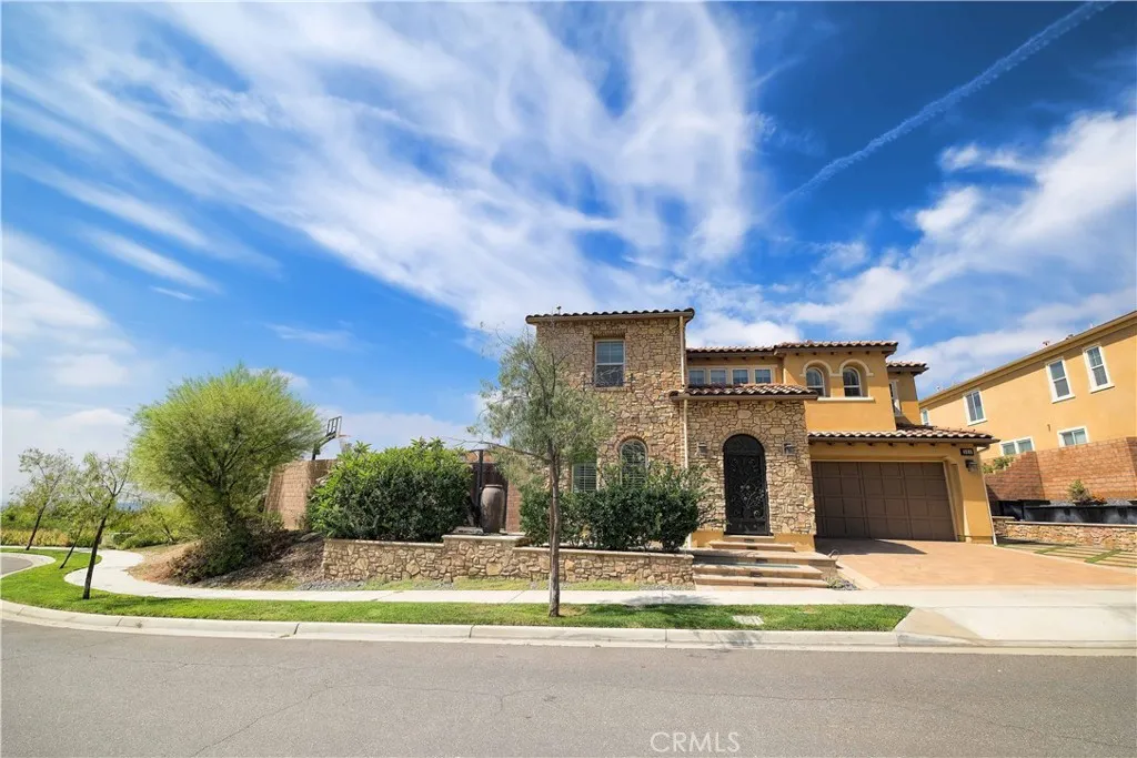 Welcoming street view of this two-story home with landscaped grounds and distinctive architectural details. Welcoming street view of this two-story home with landscaped grounds and distinctive architectural details.