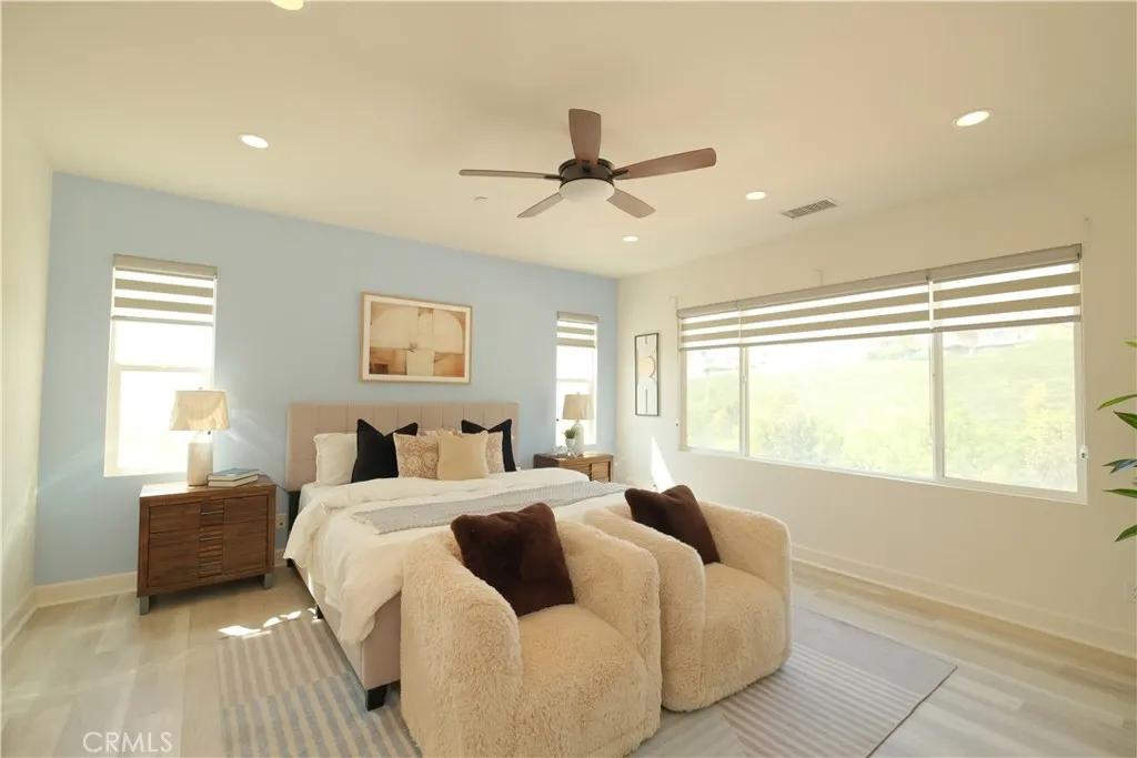an alternate bedroom view showcasing generous floor space and abundant natural light. an alternate bedroom view showcasing generous floor space and abundant natural light.
