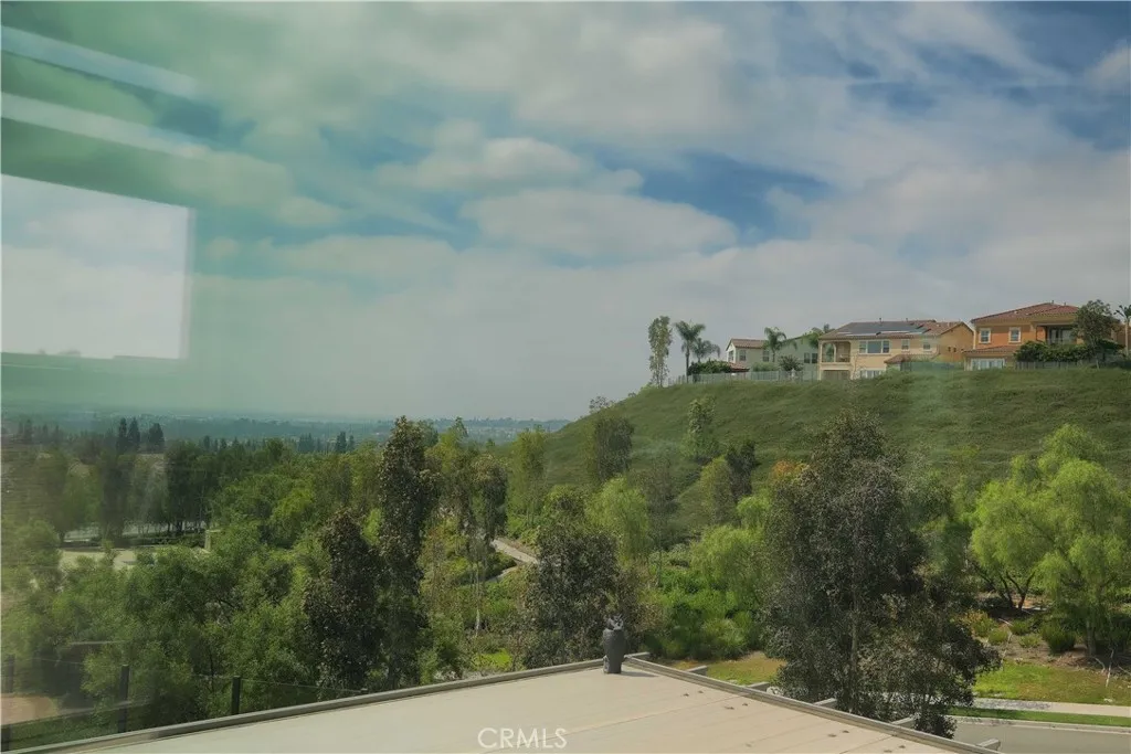 Scenic outlook across the surrounding hills beneath an expansive sky. Scenic outlook across the surrounding hills beneath an expansive sky.