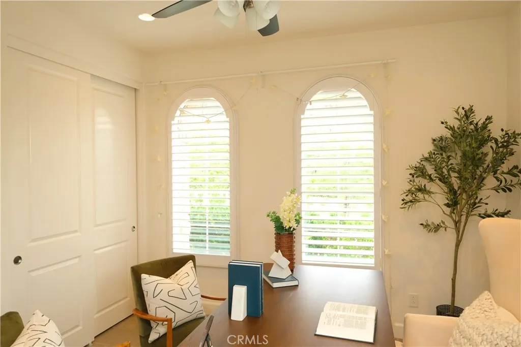 Elegant office space with paired arched windows and abundant natural light. Elegant office space with paired arched windows and abundant natural light.