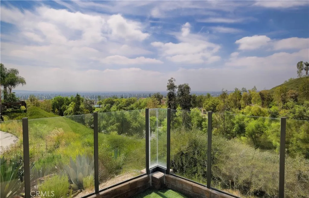 Scenic backyard outlook across treetops and nearby hills. Scenic backyard outlook across treetops and nearby hills.
