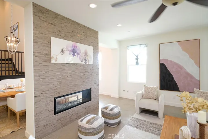 Contemporary linear fireplace set within a textured accent wall creates an inviting focal point.