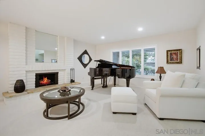 Spacious living room with oversized front window and cozy fireplace!