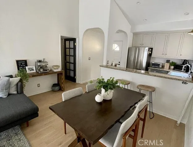 Kitchen, dining and entry way with beautiful arched doorways
