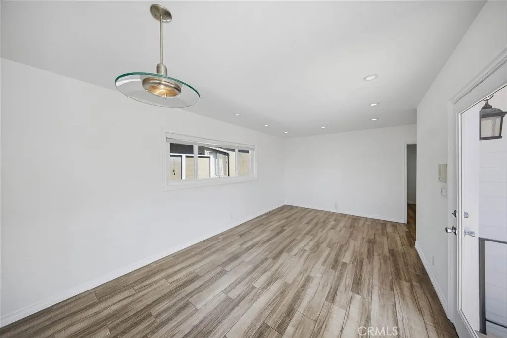 Open dining area pouring into the bright living​​‌​​​​‌​​‌‌​​‌​​​‌‌​​​‌​​‌‌​​‌‌​​‌‌​​​​ room.