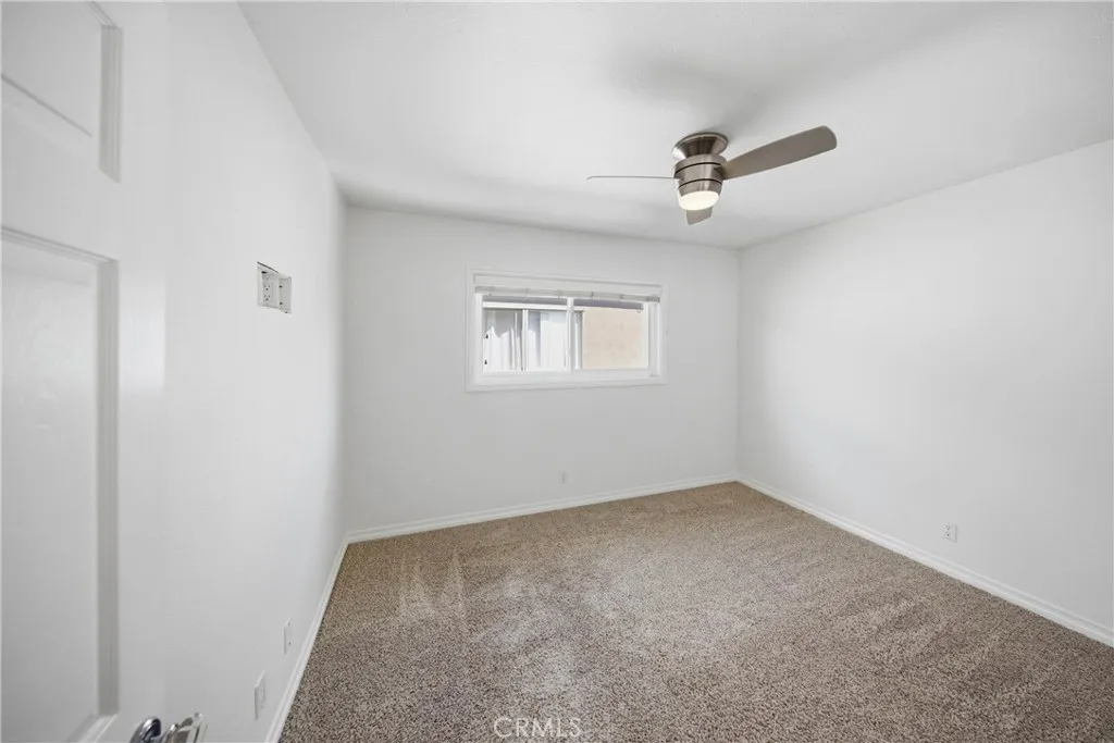 Primary bedroom with built-in storage in closets.