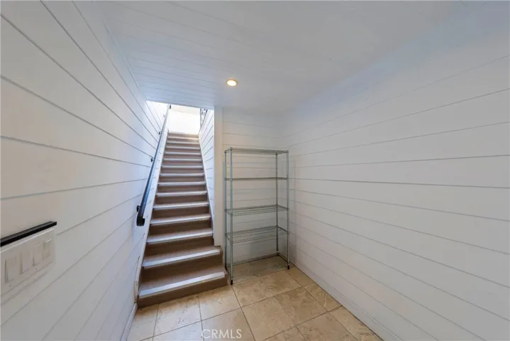 First floor private foyer with access to garage and staircase to residence.