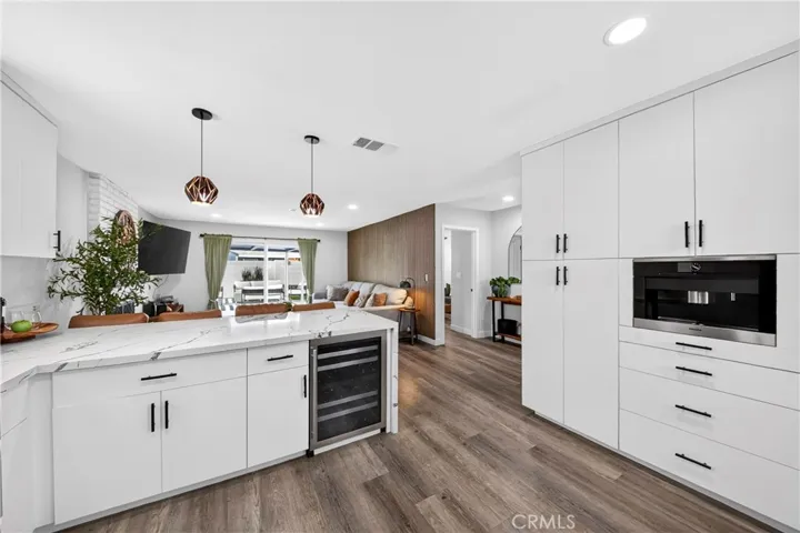 Kitchen with Built in Coffee maker and wine fridge.