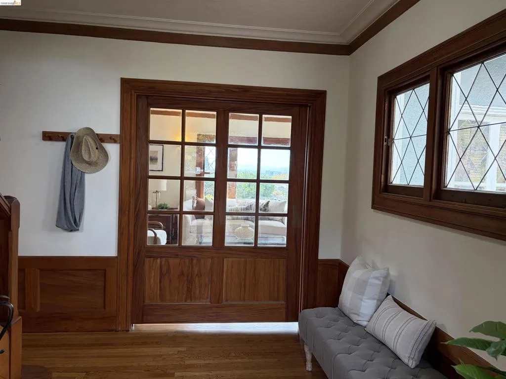 This beautiful pocket door is located between the front entry area and the main living room.