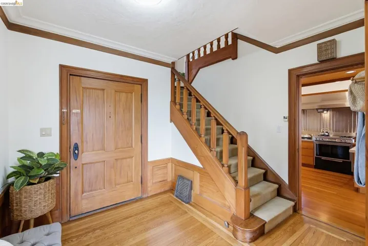 These stairs lead to the upper level that has 3 bedrooms and 2 full bathrooms.