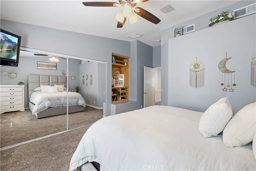 Large primary bedroom with built-ins. Large primary bedroom with built-ins.