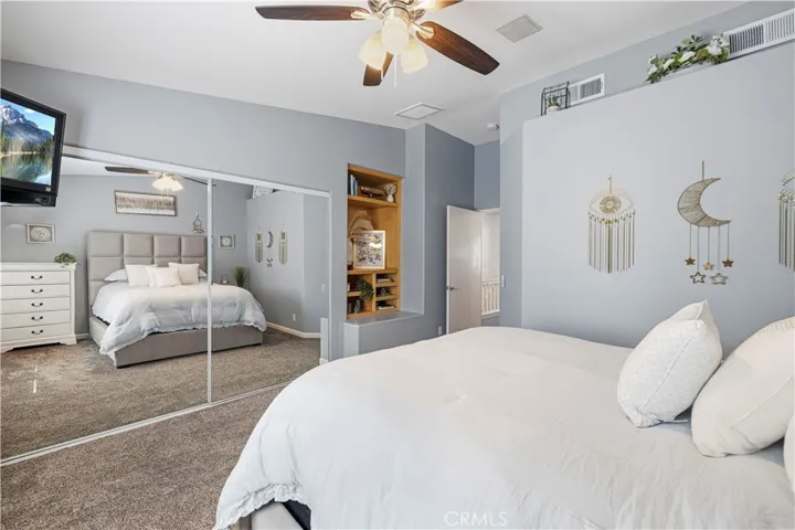 Large primary bedroom with built-ins.