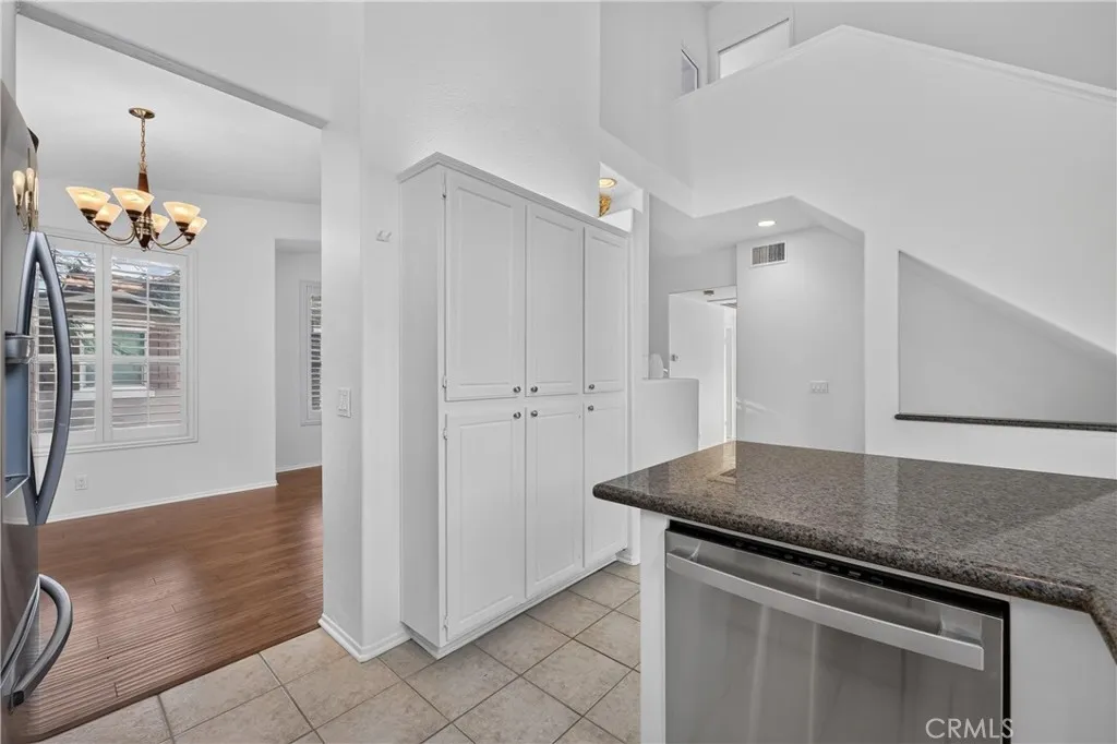 Full size pantry and view to stair case to 3rd bedroom with full bath Full size pantry and view to stair case to 3rd bedroom with full bath