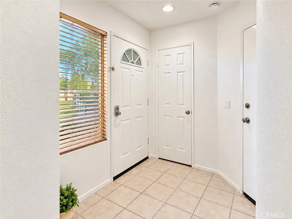 Downstairs entryway with coat closet and direct access to 2-Car garage Downstairs entryway with coat closet and direct access to 2-Car garage