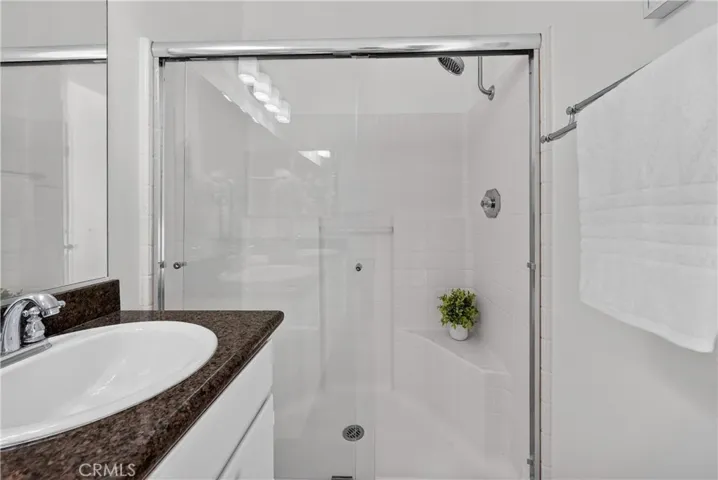 Walk-in shower at primary bedroom