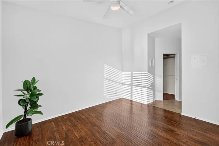 Primary bedroom with view into walk-in closet