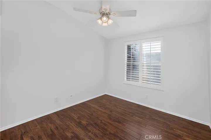second bedroom with new window and plantation shutters