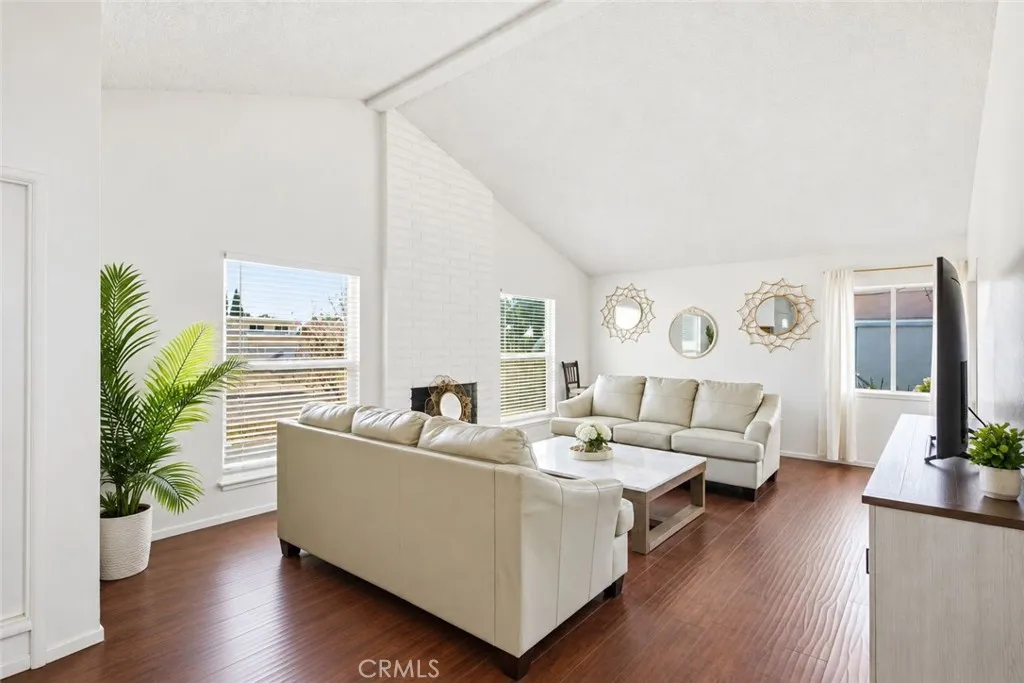 Living room with vaulted ceilings and wood floors Living room with vaulted ceilings and wood floors