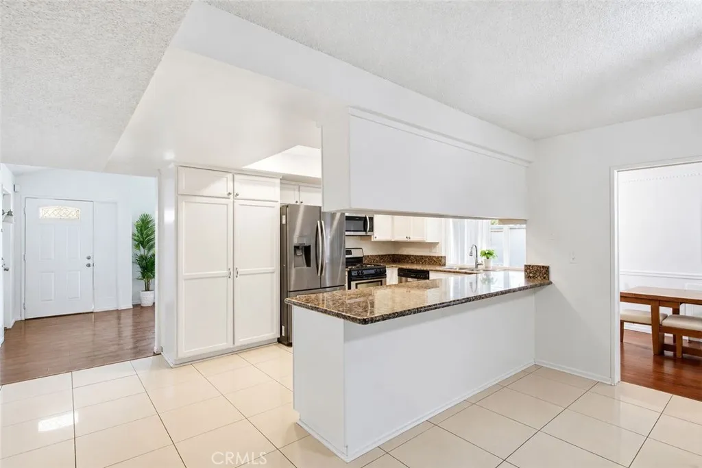 large kitchen with eat on bar large kitchen with eat on bar
