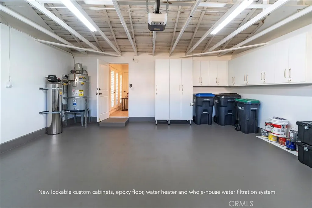 New epoxy floor, insulated garage door, lockable cabinets, new water heater, whole-house water filtration system New epoxy floor, insulated garage door, lockable cabinets, new water heater, whole-house water filtration system