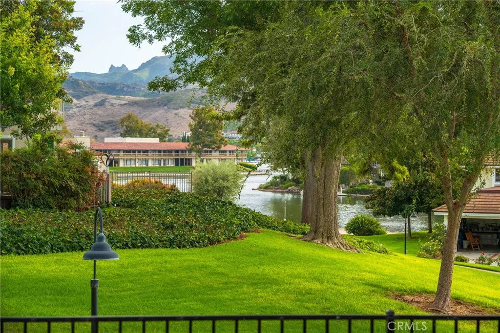 Lake views from back patio, shops & restaurants beyond. Lake views from back patio, shops & restaurants beyond.