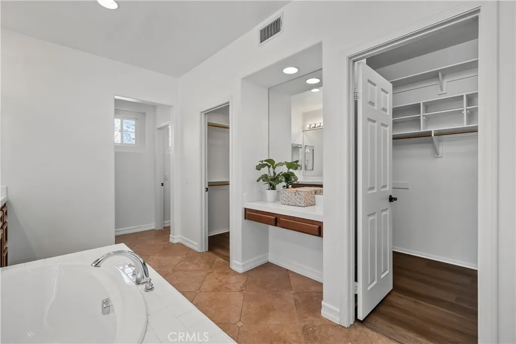 Primary Suite Bathroom & Walk-In Primary Suite Bathroom & Walk-In