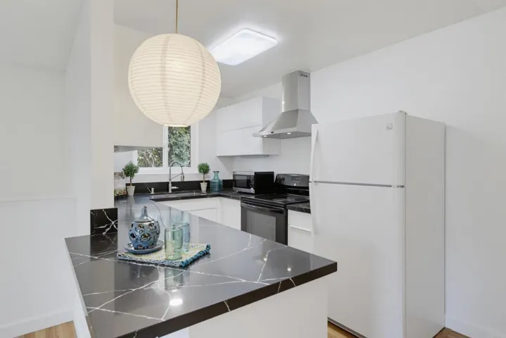 Gorgeous quartz countertop with sleek european soft-close cabinetry
