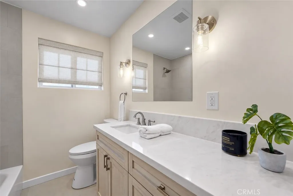This pic. contains virtually staged window treatments and a digitally altered mirror This pic. contains virtually staged window treatments and a digitally altered mirror