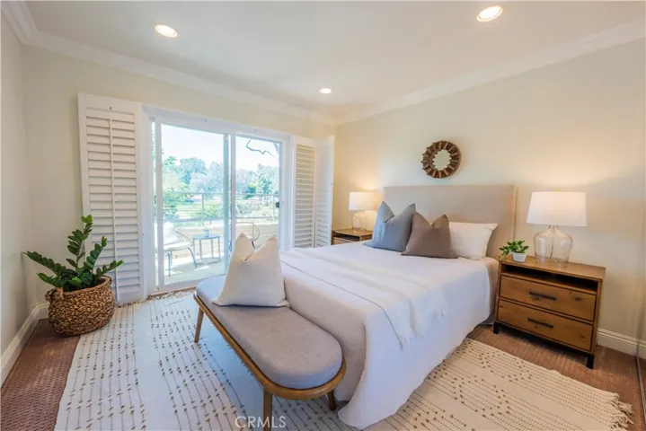 Guest Bedroom with Slider/Shutters to Patio
