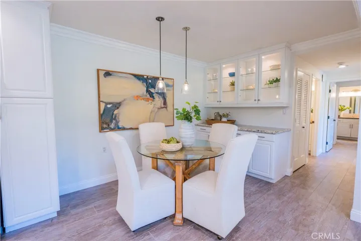 Lovely Spacious Dining Area with Built In Cabinets with Glass/Lit Doors