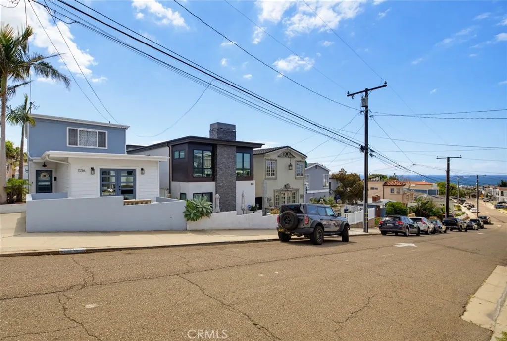 Situated on a wide quiet one-way street, with ocean views that start before you even step inside...perfect curb appeal because the garage is in the rear of this "street to street" lot. Situated on a wide quiet one-way street, with ocean views that start before you even step inside...perfect curb appeal because the garage is in the rear of this "street to street" lot.