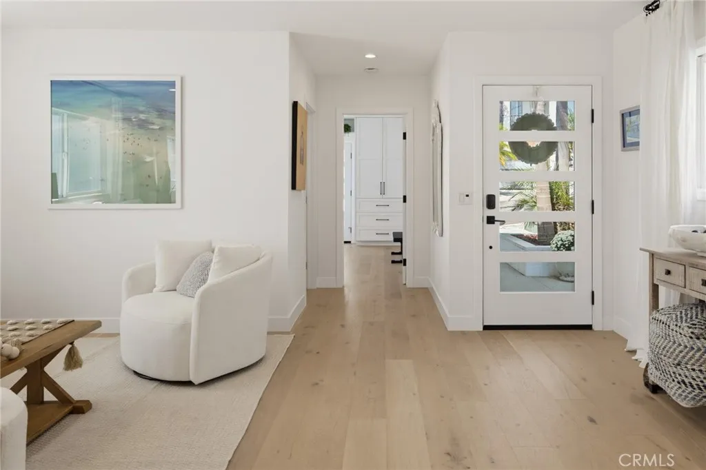 Just inside the entry, with a view towards the ground floor bedroom in the front Just inside the entry, with a view towards the ground floor bedroom in the front