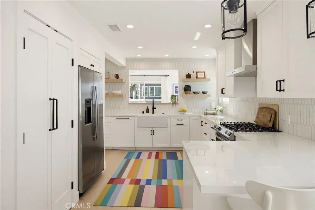 So much counter space, and that's a double door, reach/step-in pantry to the left of the refrigerator. So much counter space, and that's a double door, reach/step-in pantry to the left of the refrigerator.
