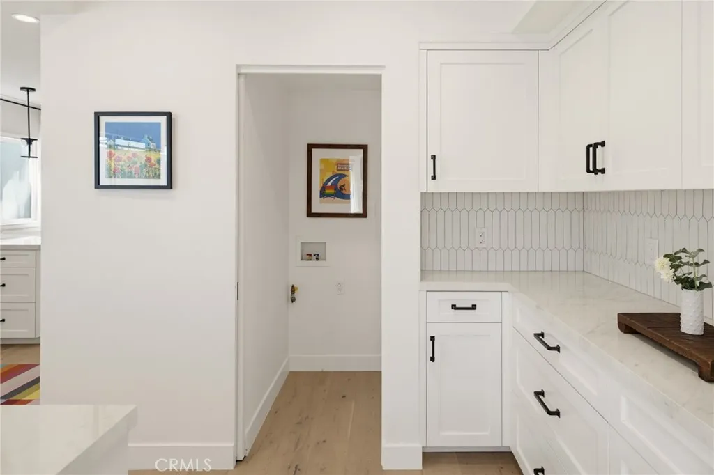 Laundry hookups ready for your stack washer and dryer; a sliding door hides it all when not in use. Laundry hookups ready for your stack washer and dryer; a sliding door hides it all when not in use.