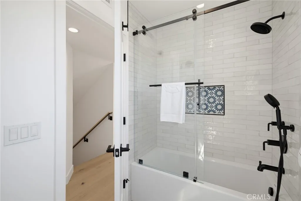 Shower in bath combo, modern fixtures, tiled niche Shower in bath combo, modern fixtures, tiled niche