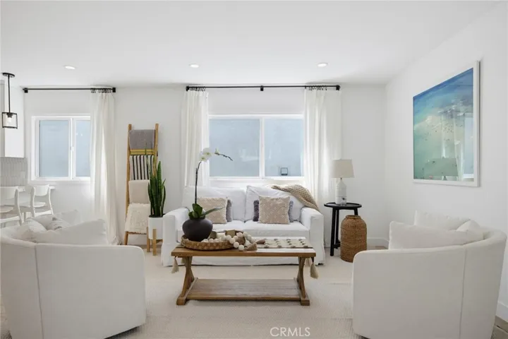 Step inside the living room...kitchen to the left, bed/bath to the right.