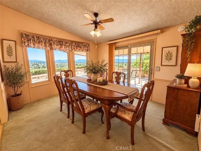 Dining Area with Fabulous Views of the City Lights, Mountains & Hills. Sliding Door to Patio. Virtually Staged.