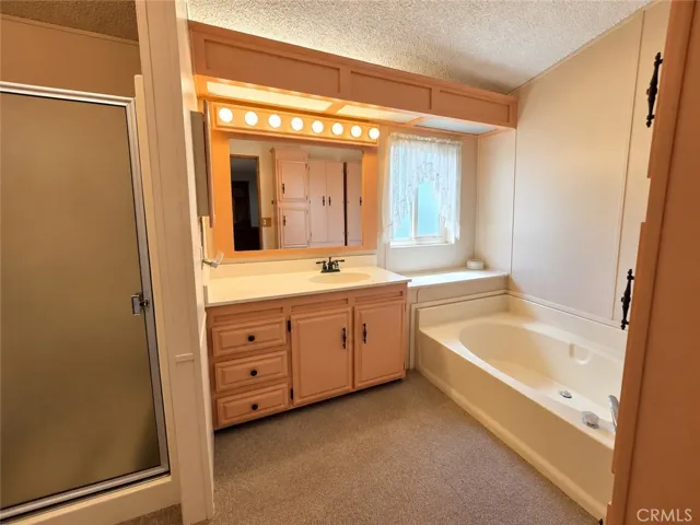 Primary Bathroom with Separate Tub & Shower and extra storage!
