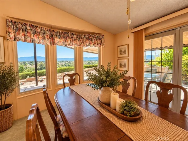 Dining Area with Fabulous Views of the City Lights, Mountains & Hills. Virtually Staged.