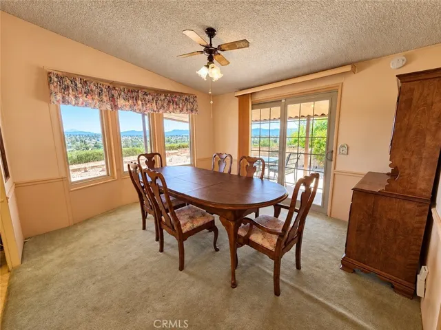 Dining Area with Fabulous Views of the City Lights, Mountains & Hills. Sliding Door to Patio.