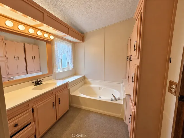 Primary Bathroom with Separate Tub & Shower and extra storage!