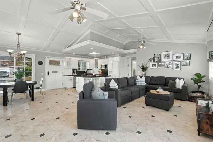 You’re greeted by an expansive great room creating a light-filled, open-concept living space that connects the kitchen with large center island, living and dining areas.