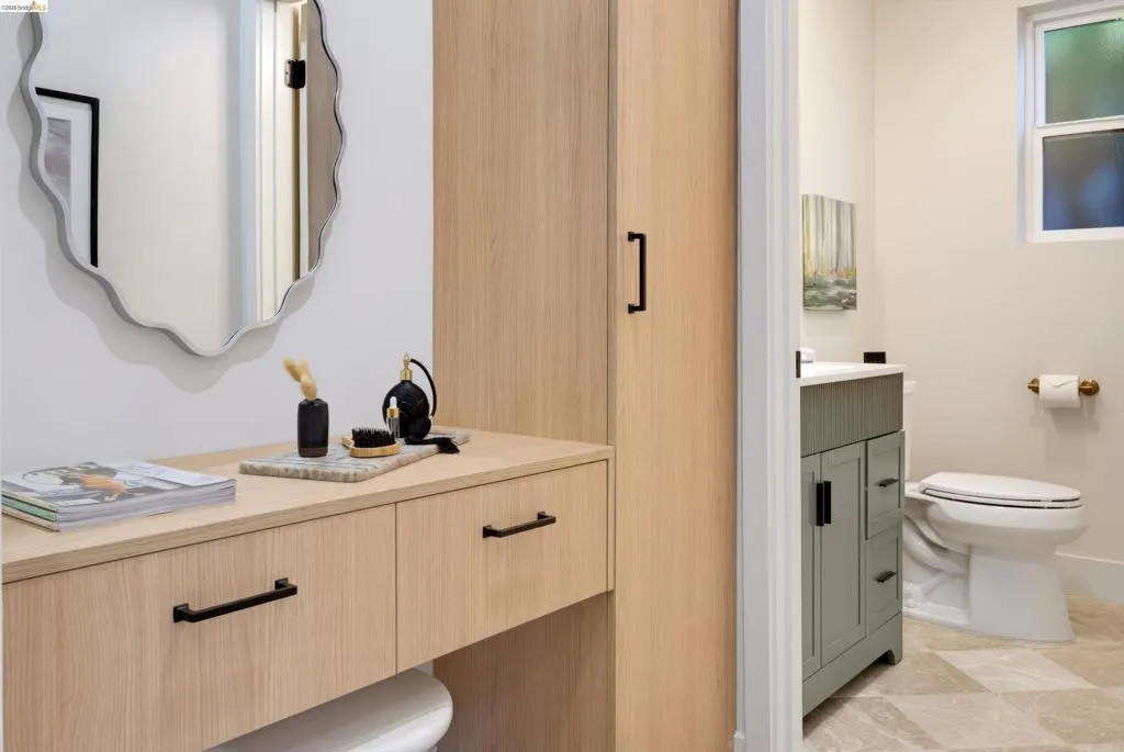 Built-in storage and drop zone with adjacent powder room.