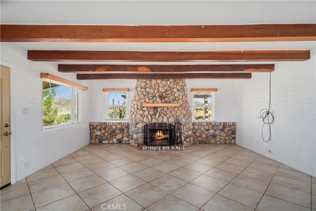 Virtually staged/altered with flames in fireplace
